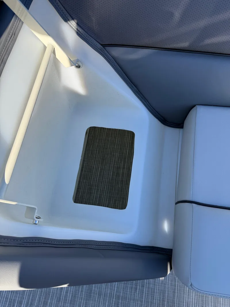 Slide: The Image of Interior seating of 2025 Viaggio V22U boat, featuring modern design and comfortable cushions. - 11