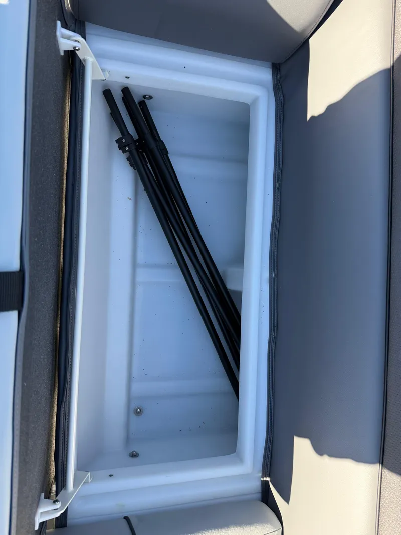 Slide: The Image of Open storage compartment in 2025 Viaggio V22U boat, containing metal rods. - 12