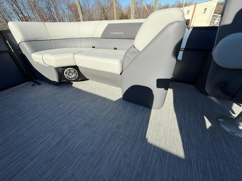 Slide: The Image of 2025 Viaggio V22U boat interior with gray seating and carpeted flooring. - 19