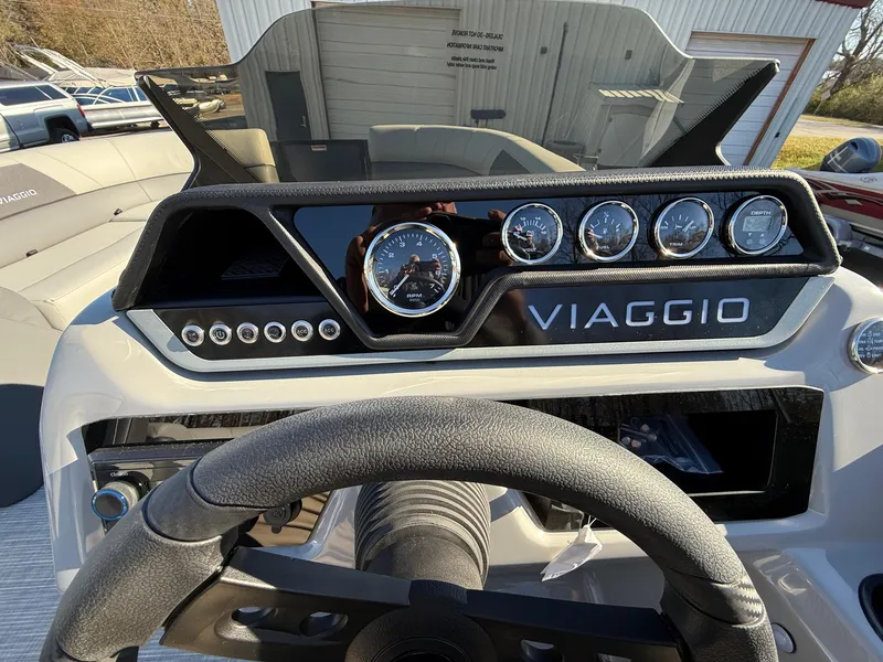 Slide: The Image of Dashboard of 2025 Viaggio V22U boat with gauges and steering wheel. - 21