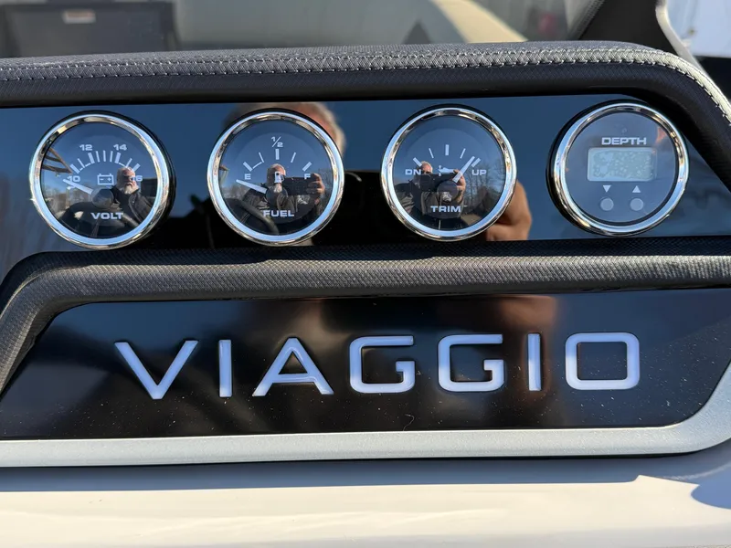 Slide: The Image of Viaggio V22U 2025 dashboard with volt, fuel, trim, and depth gauges. - 24