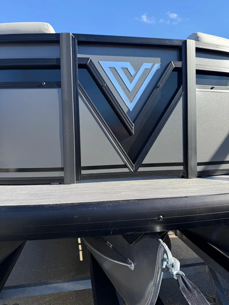 Slide: The Image of 2025 Viaggio x20u boat with sleek design and prominent logo under a clear blue sky. - 18