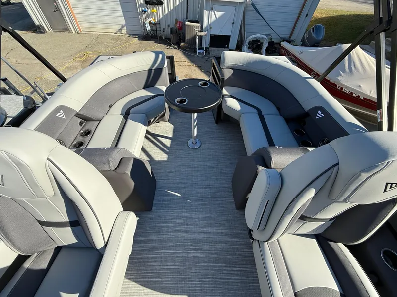 Slide: The Image of Luxurious seating on 2025 Viaggio x20u boat with round table, gray upholstery. - 9