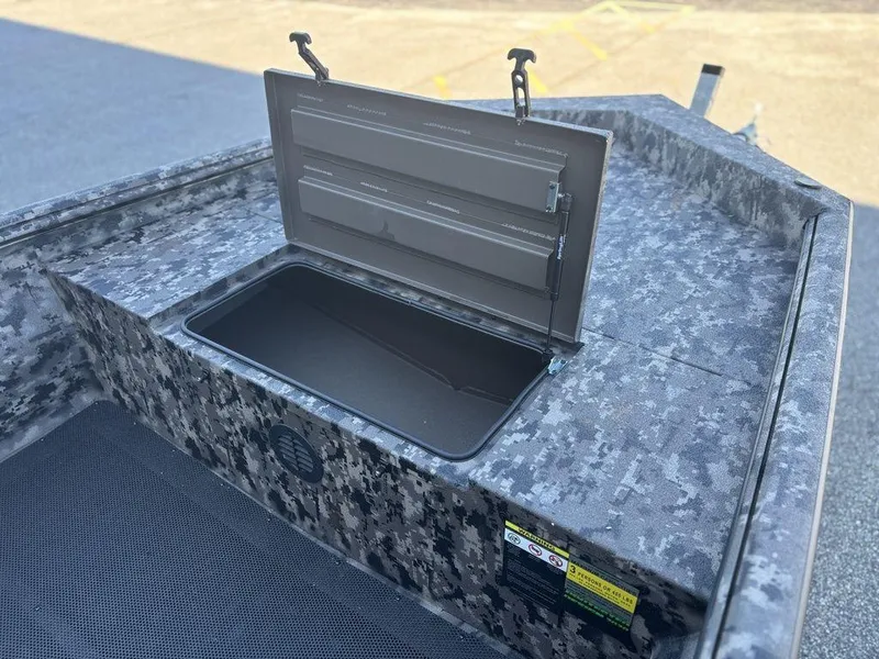 Slide: The Image of 2025 Havoc RDBST 1553 boat with camouflage pattern in a parking lot. - 16