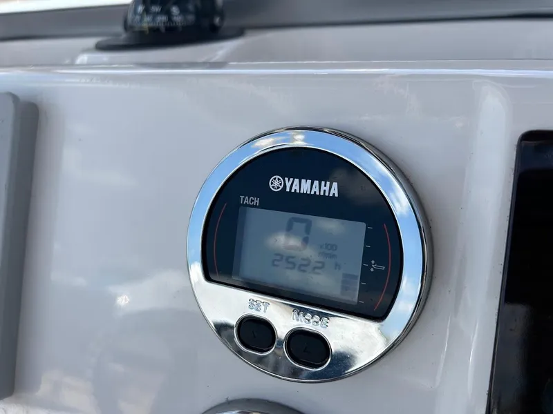 Slide: The Image of Yamaha tachometer on 2019 Robalo R202EX boat dashboard, displaying 2522 hours. - 12