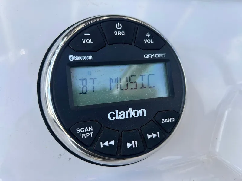 Slide: The Image of Clarion Bluetooth stereo system on 2019 Robalo R202EX boat, displaying "BT MUSIC". - 13