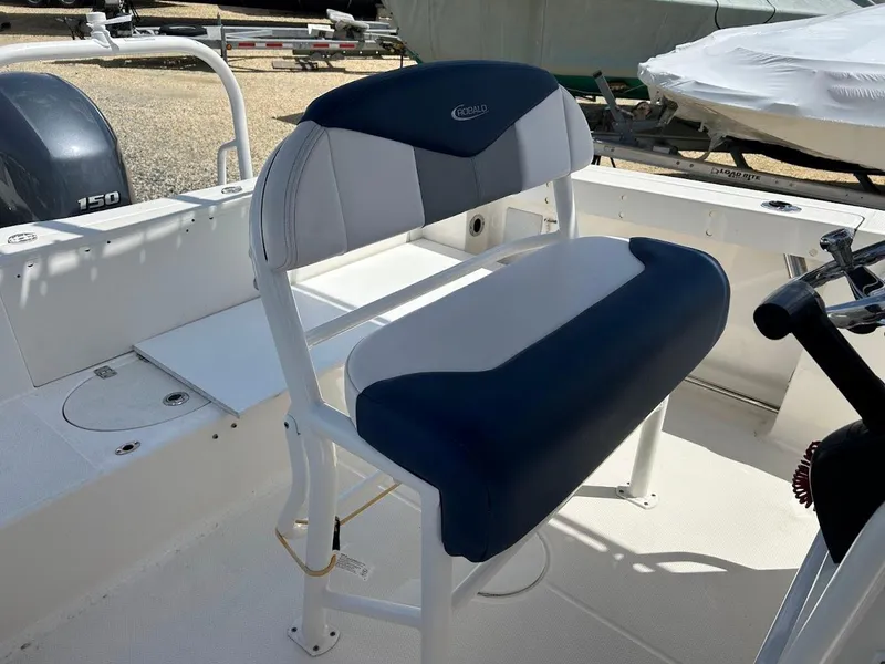 Slide: The Image of 2019 Robalo R202EX boat seat with blue and white upholstery. - 16