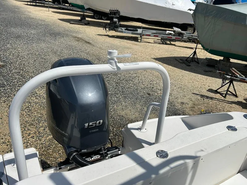 Slide: The Image of 2019 Robalo R202EX boat with Yamaha 150 engine in a boatyard. - 17