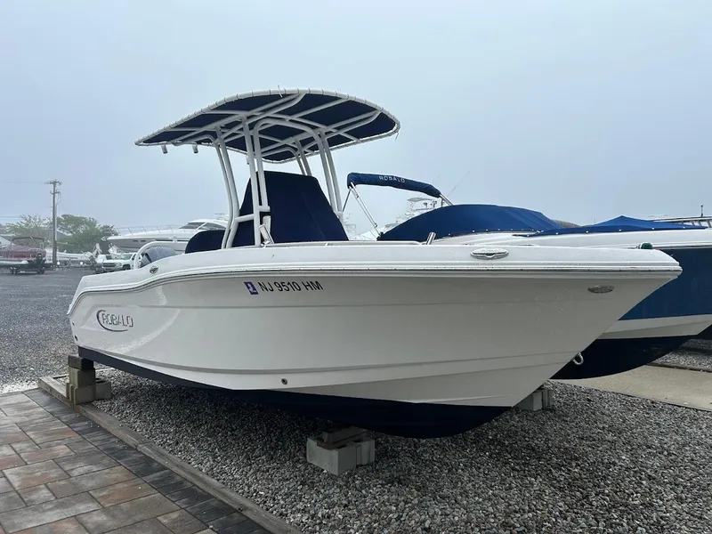 Slide: The Image of 2019 Robalo R202EX boat on display, featuring a sleek white hull and T-top. - 20