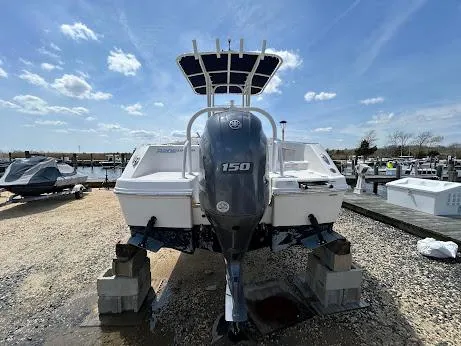 Slide: The Image of 2019 Robalo R202EX boat with Yamaha 150 engine, displayed outdoors on blocks. - 9
