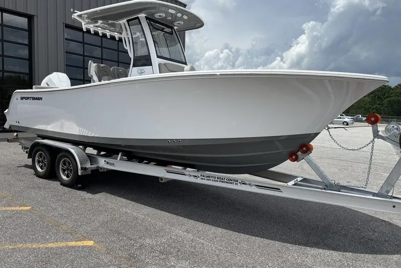The Image of 2025 Sportsman Heritage 231 boat on trailer, parked outdoors. - 0