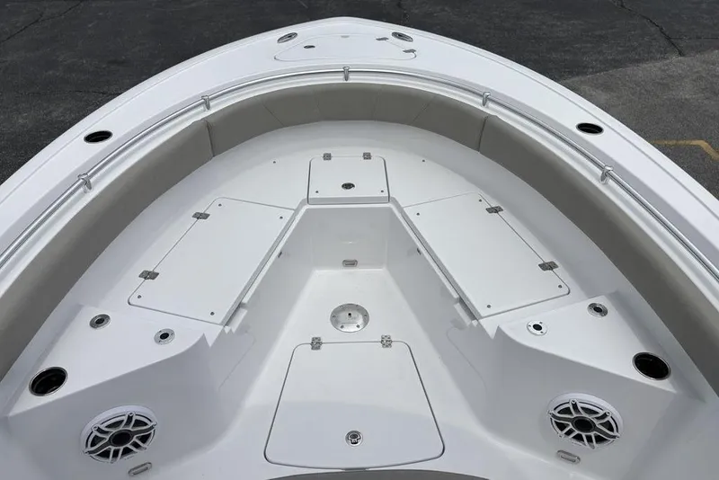 Slide: The Image of 2025 Sportsman Heritage 231 boat interior with seating and storage compartments. - 11