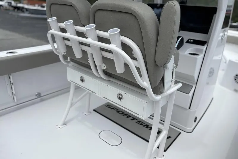 Slide: The Image of 2025 Sportsman Heritage 231 boat interior with rod holders and seating. - 18