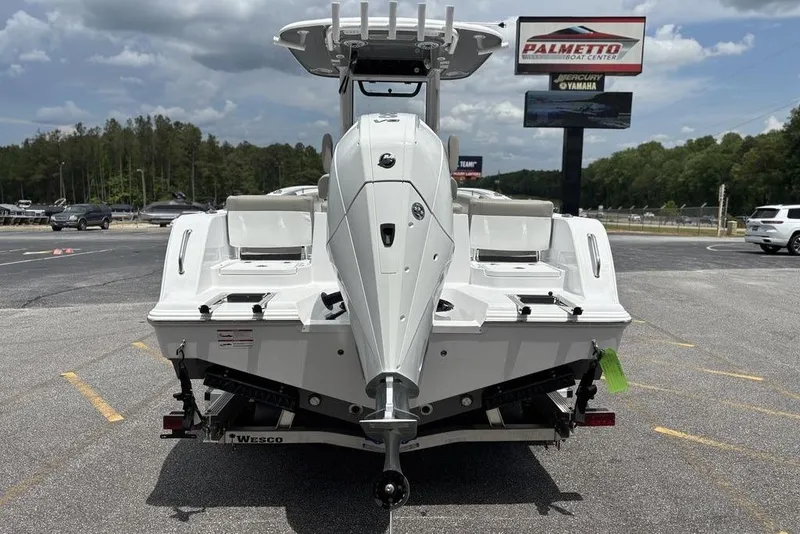 Slide: The Image of 2025 Sportsman Heritage 231 boat displayed at Palmetto Boat Center parking lot. - 26
