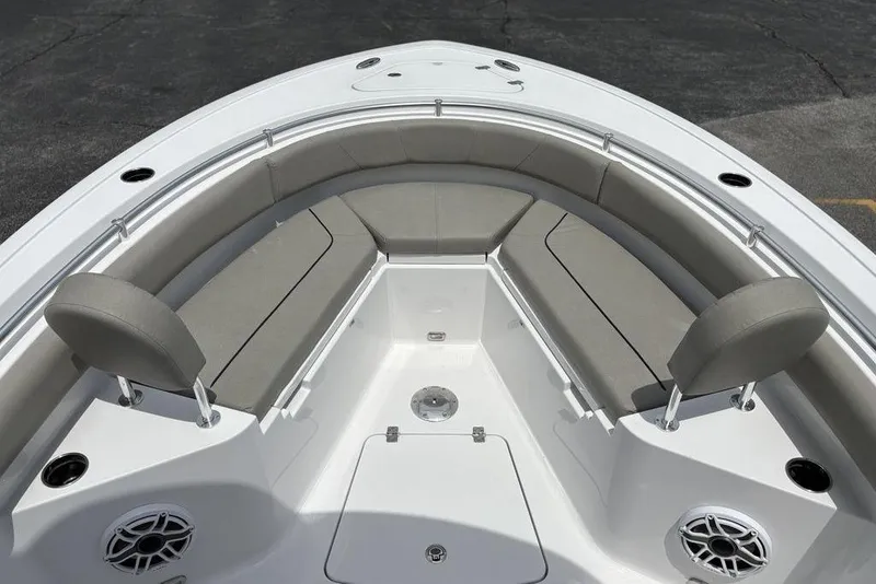 Slide: The Image of 2025 Sportsman Heritage 231 boat interior with cushioned seating and modern design. - 8