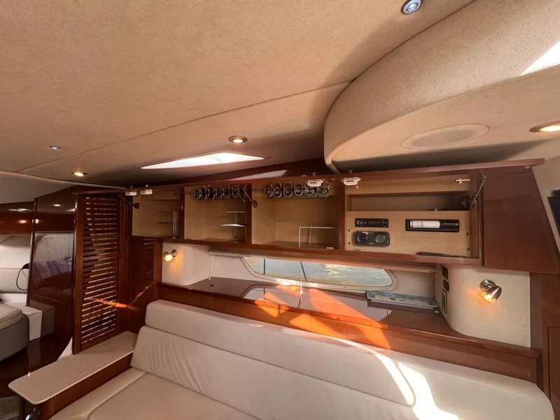 Slide: The Image of Interior of 2009 Sea Ray 350 Sundancer yacht with elegant wood cabinetry and seating. - 27
