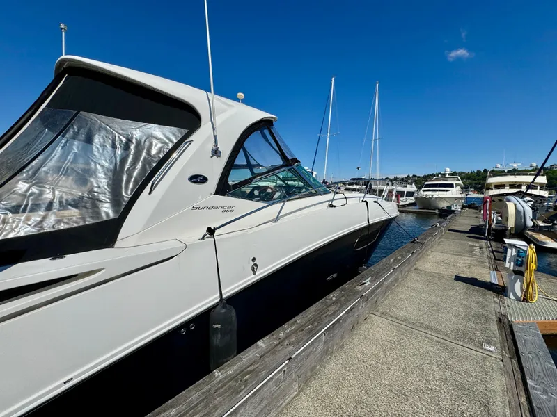 Slide: The Image of 2009 Sea Ray 350 Sundancer docked at marina under clear blue sky. - 3