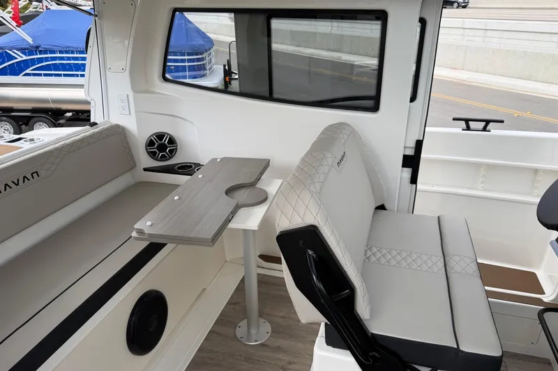 Slide: The Image of Interior of 2026 Navan C30 boat with seating and table, showcasing modern design. - 11