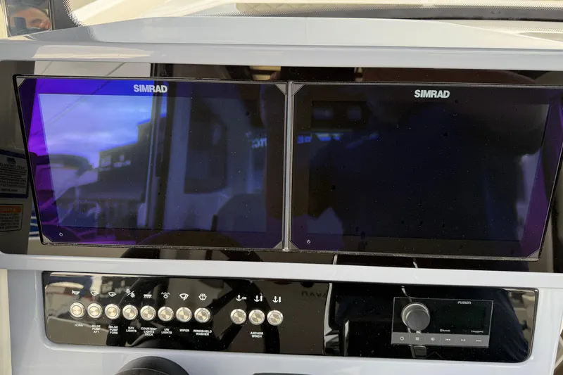 Slide: The Image of Control panel of 2026 Navan C30 with dual Simrad displays and buttons. - 18