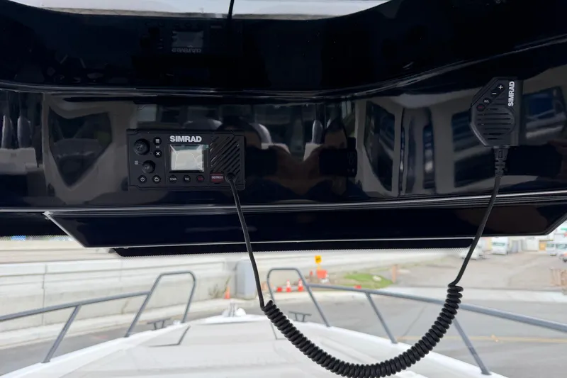 Slide: The Image of Simrad radio system on Navan C30 boat, 2026 model, with microphone and control panel. - 19