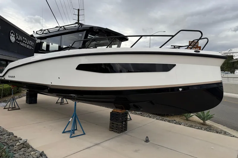Slide: The Image of 2026 Navan C30 boat displayed at Sun Country Marine Group dealership. - 4