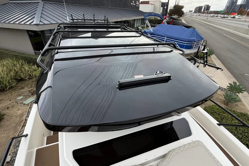 Slide: The Image of 2026 Navan C30 boat with sleek black roof and rooftop railings. - 40