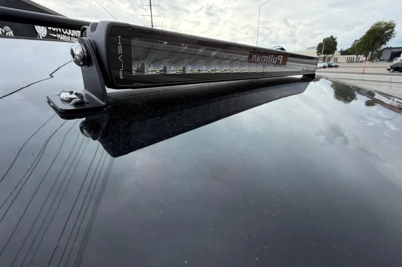 Slide: The Image of Rooftop light bar on 2026 Navan C30, reflecting cloudy sky. - 41