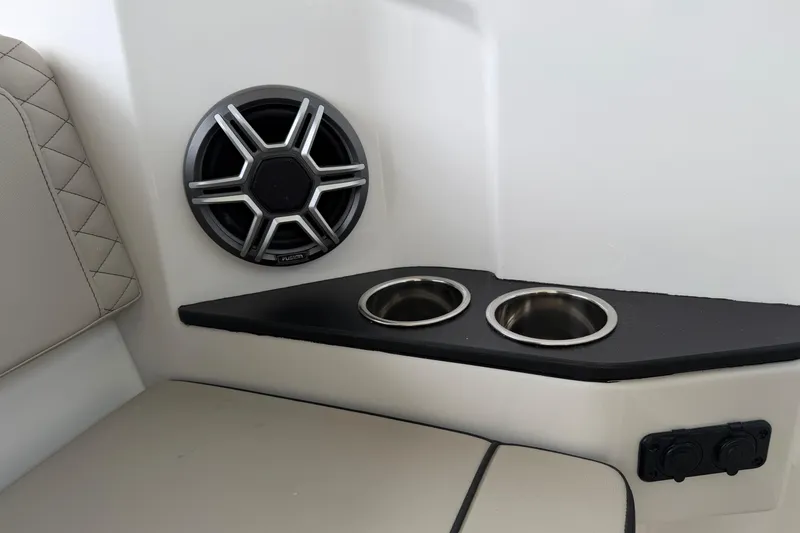Slide: The Image of Interior of 2026 Navan C30 boat with speaker and cup holders. - 44