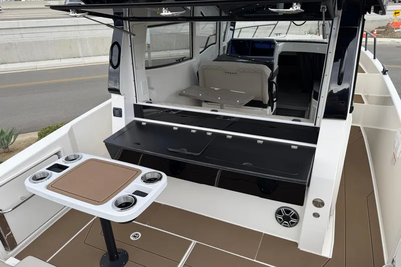 Slide: The Image of 2026 Navan C30 boat interior with seating, table, and storage compartments. - 8