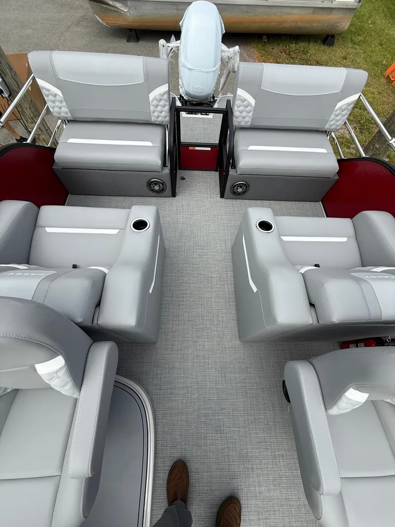 Slide: The Image of 2025 Crest 220 SLRC boat interior with gray seating and cup holders. - 10