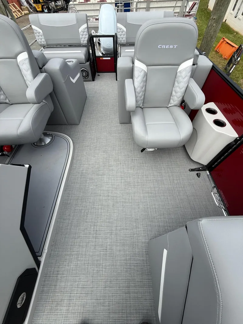 Slide: The Image of 2025 Crest 220 SLRC boat interior with gray seating and modern design. - 11