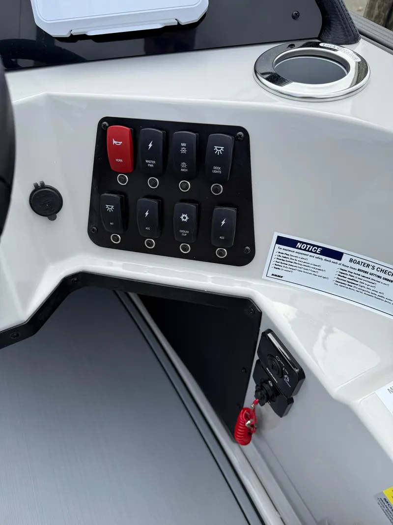 Slide: The Image of Control panel of 2025 Crest 220 SLRC boat with switches and safety instructions. - 14