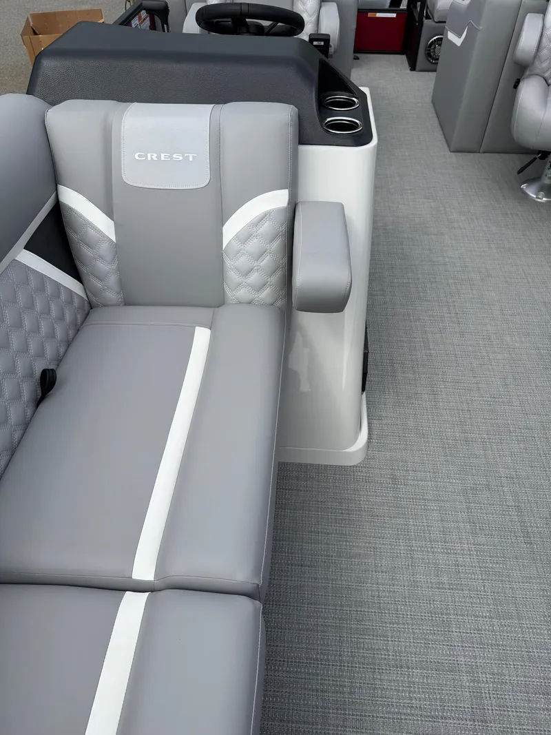 Slide: The Image of 2025 Crest 220 SLRC boat interior with gray seating and modern design. - 20
