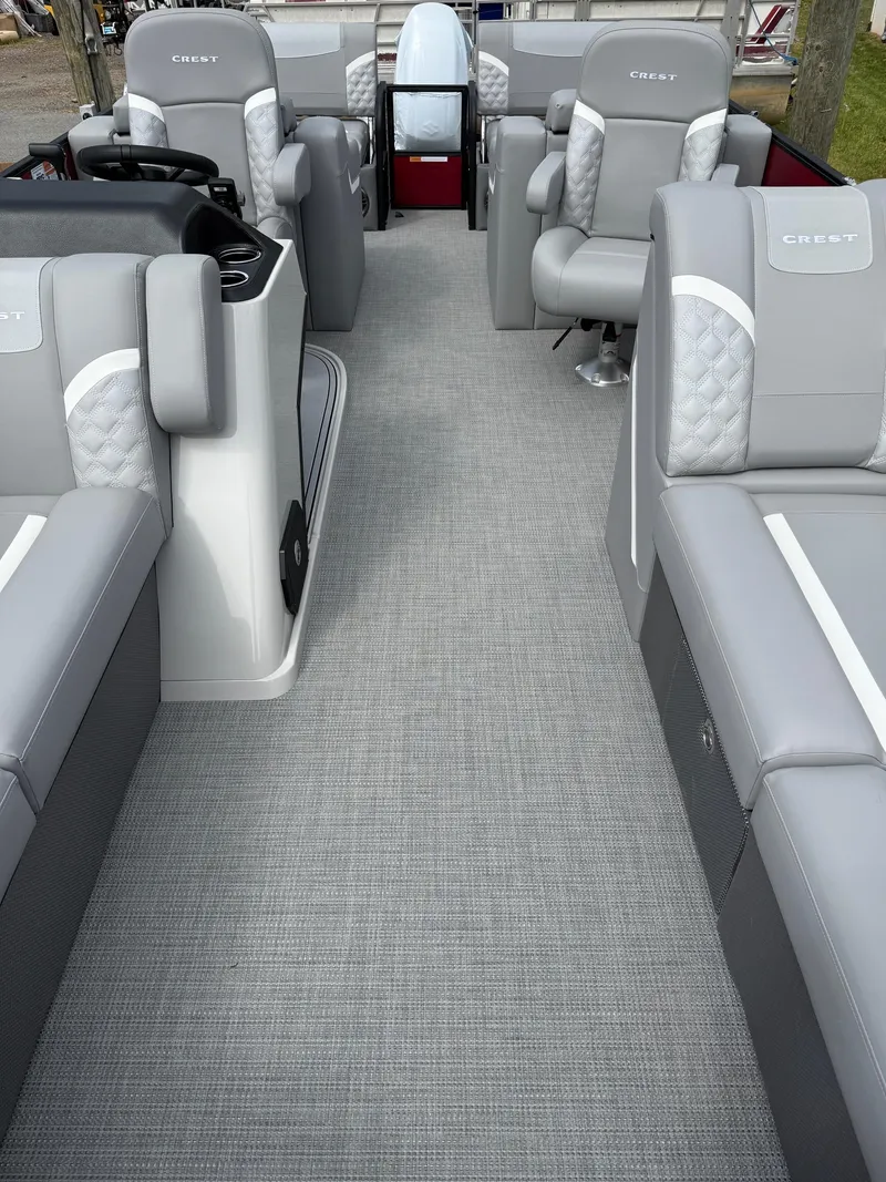Slide: The Image of 2025 Crest 220 SLRC pontoon boat interior with gray seating and modern design. - 23