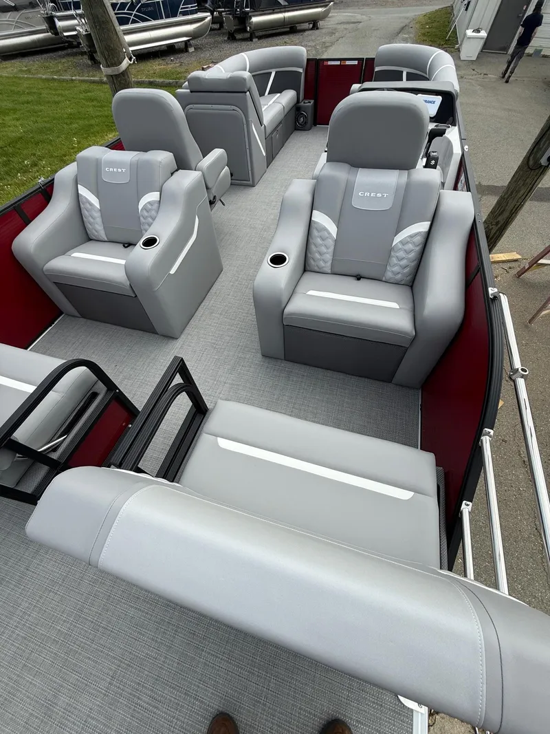Slide: The Image of 2025 Crest 220 SLRC pontoon boat with luxurious gray seating and spacious layout. - 4