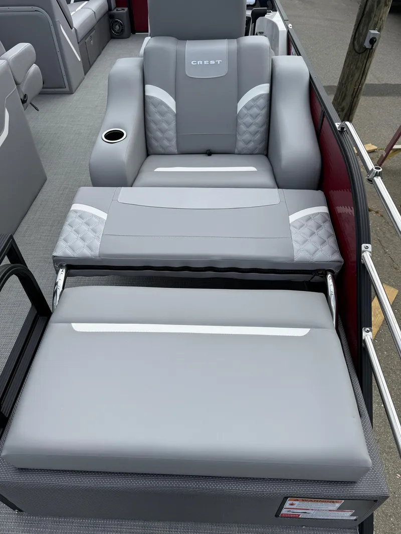 Slide: The Image of Luxurious seating on 2025 Crest 220 SLRC boat with cup holder and adjustable backrest. - 6