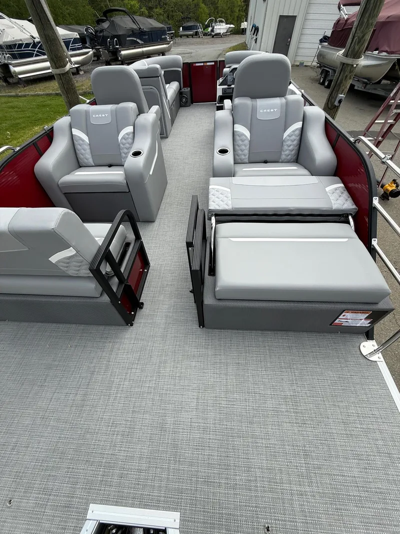 Slide: The Image of 2025 Crest 220 SLRC pontoon boat with spacious seating and modern design. - 7