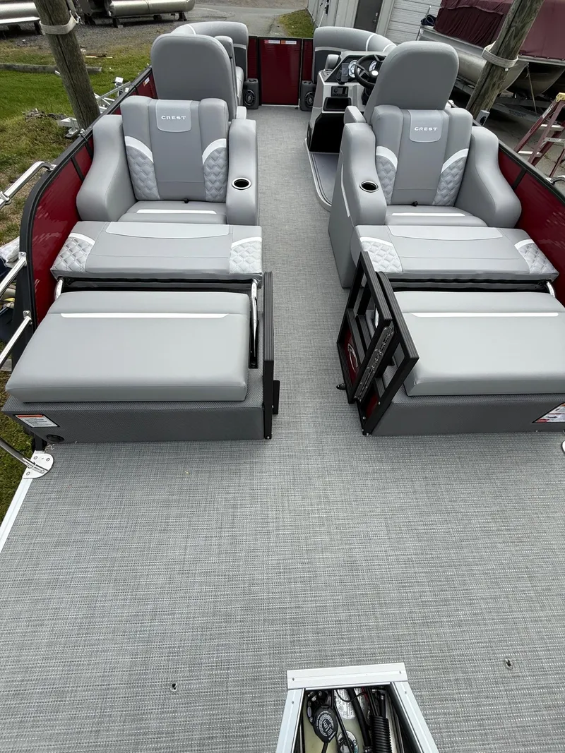 Slide: The Image of 2025 Crest 220 SLRC pontoon boat with spacious seating and modern design. - 8
