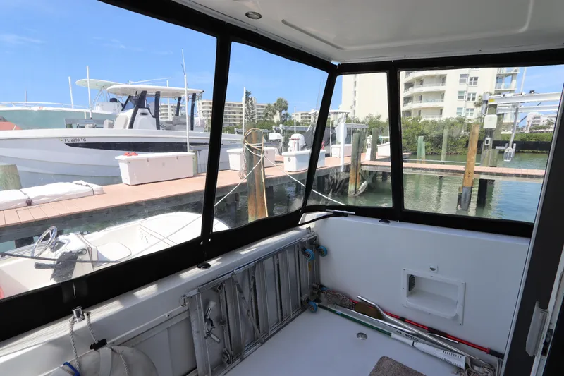 Slide: The Image of Enclosed deck view of 2001 Navigator 4800 CLASSIC yacht at marina. - 12