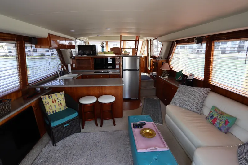 Slide: The Image of Interior of 2001 Navigator 4800 CLASSIC yacht with modern kitchen and cozy seating area. - 15