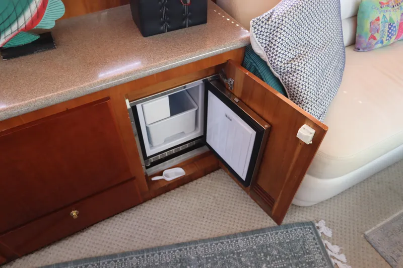 Slide: The Image of Open mini fridge in 2001 Navigator 4800 CLASSIC yacht interior. - 19