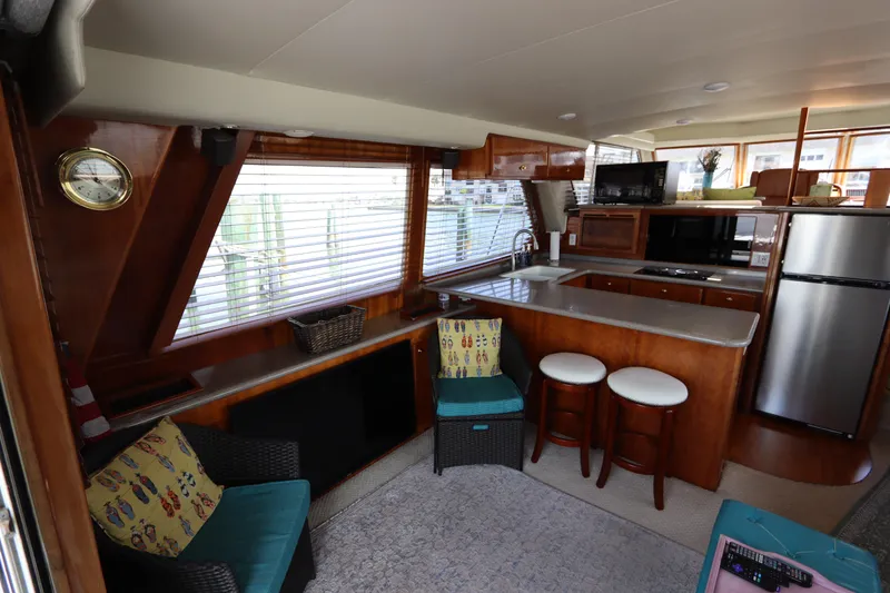 Slide: The Image of Interior of 2001 Navigator 4800 CLASSIC yacht with kitchen and seating area. - 21
