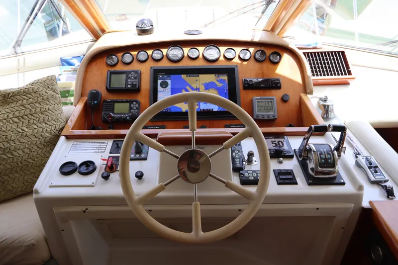 Slide: The Image of Navigator 4800 CLASSIC 2001 yacht helm with steering wheel and navigation instruments. - 30