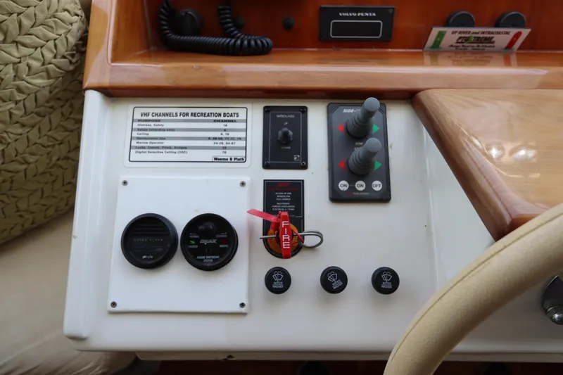 Slide: The Image of Navigator 4800 CLASSIC 2001 boat control panel with gauges and switches. - 31