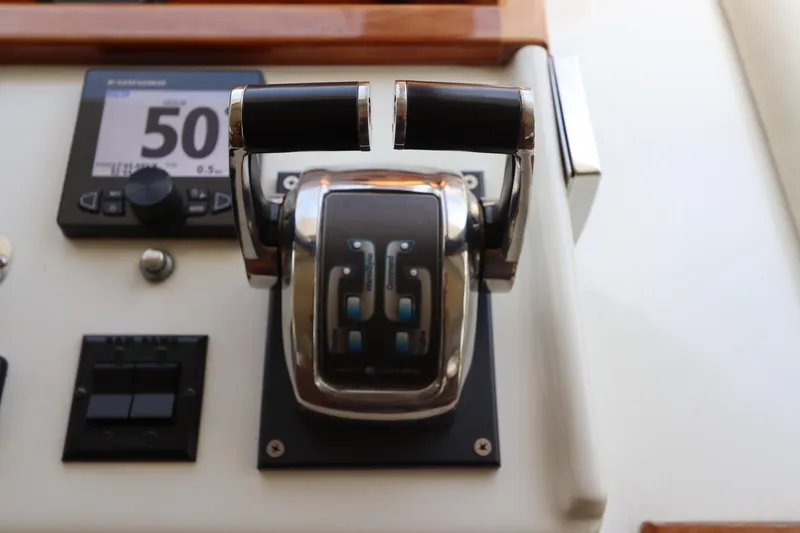 Slide: The Image of Control panel of 2001 Navigator 4800 CLASSIC yacht with throttle and display. - 33