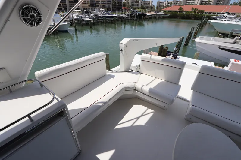 Slide: The Image of 2001 Navigator 4800 CLASSIC yacht with white seating, docked in a marina. - 46