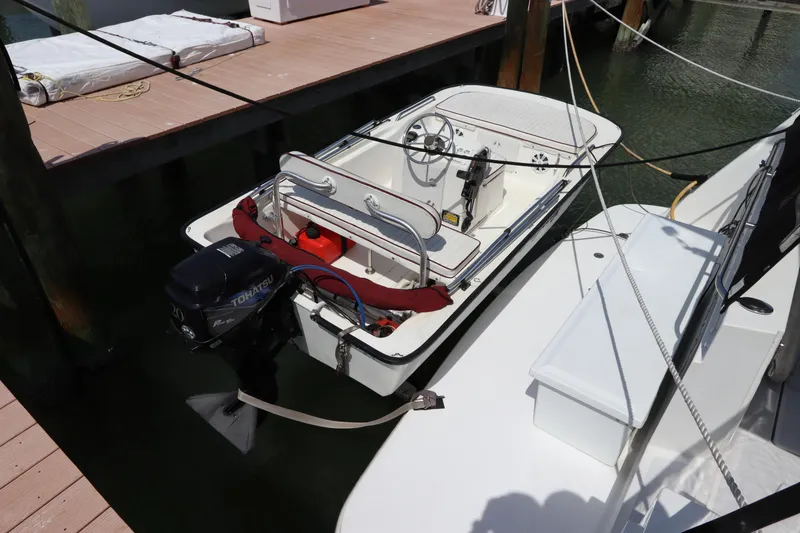 Slide: The Image of 2001 Navigator 4800 CLASSIC boat docked, featuring outboard motor and steering wheel. - 9
