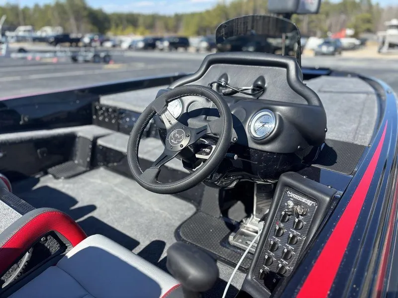 Slide: The Image of 2025 Phoenix 721 ZXL boat interior with steering wheel and control panel. - 11