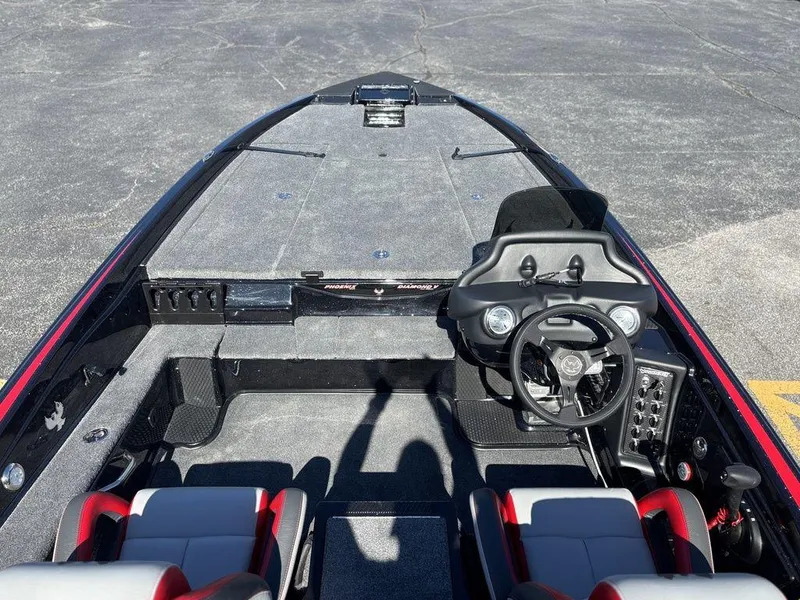 Slide: The Image of 2025 Phoenix 721 ZXL boat interior with steering wheel and seating, viewed from above. - 12