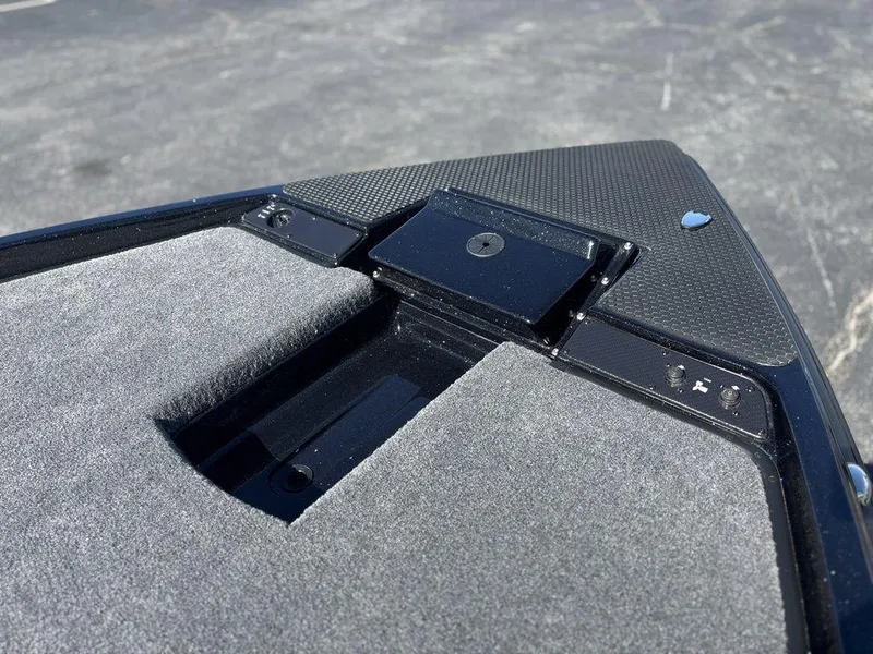 Slide: The Image of Bow of 2025 Phoenix 721 ZXL boat with carpeted deck and storage compartment. - 13